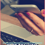 hand holding phone, laptop on desk, text free Spanish resources